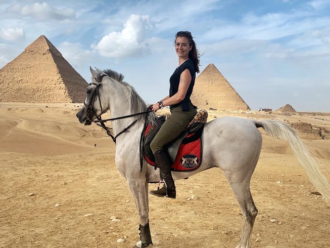 Horse rider in front of the pyramids - egypt