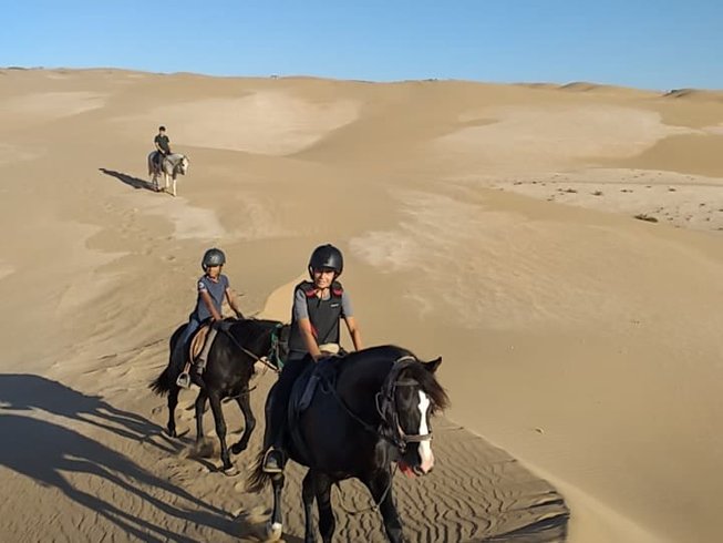 People riding in the Moroccan desert