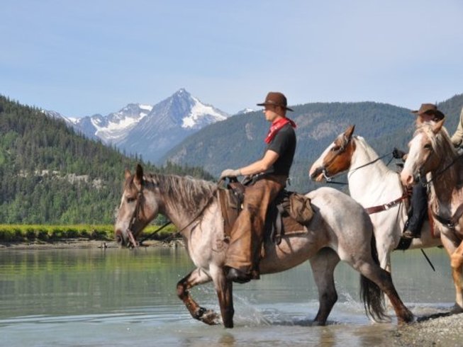 Horse rider in a river in Canada